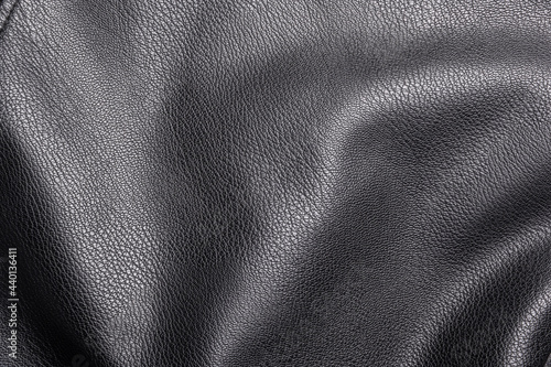 Closeup of black heavy leather material with deep texture, highlights and shade for design, texture background and displacement maps, with large canvas and copy space