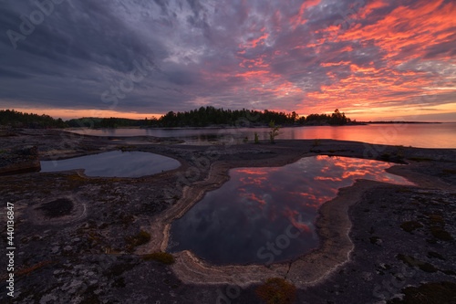 Stone shore of Lake Ladoga on a summer evening
