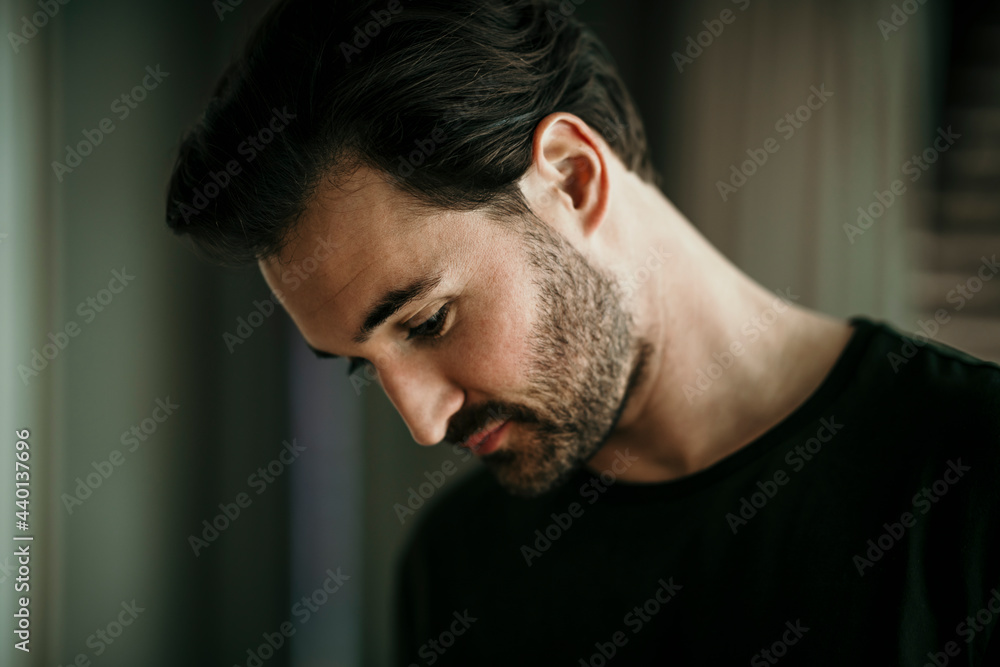 Mid adult man looking down Mid adult man looking down