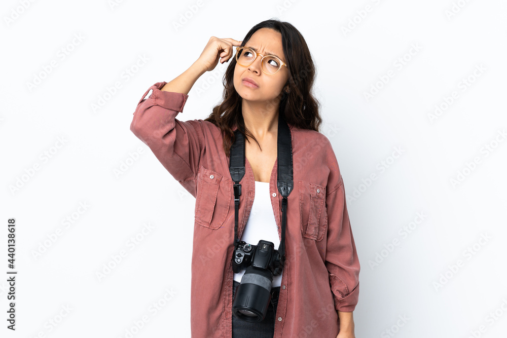 Young photographer woman over isolated white background making the gesture of madness putting finger on the head Young photographer woman over isolated white background making the gesture of madness putting finger on the head