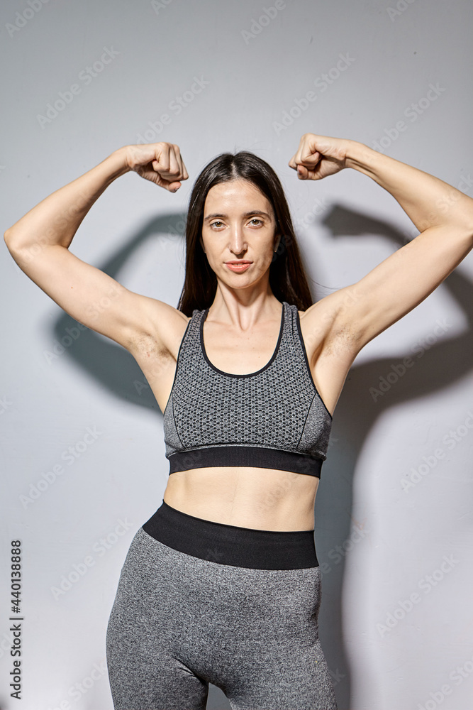 A woman raised her hand to show the hair under her armpits. A natural