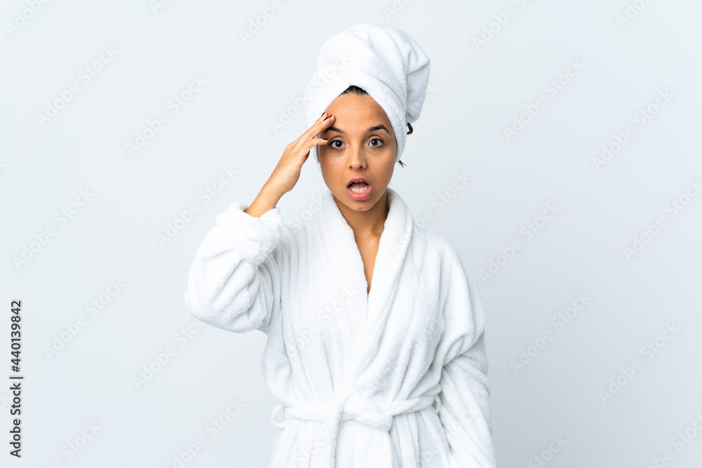 Young woman in bathrobe over isolated white background has realized something and intending the solution Young woman in bathrobe over isolated white background has realized something and intending the solution