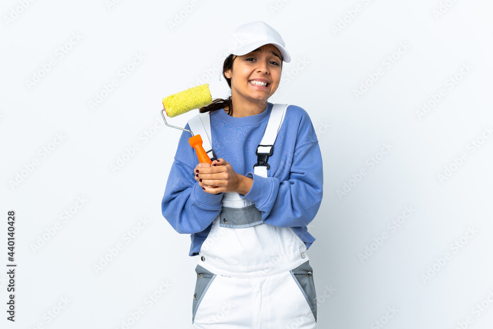 Painter woman over isolated white background laughing
