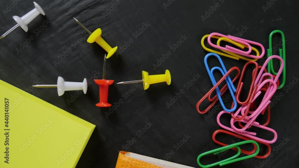 Back to school. Note paper, paper clips, pins. space for text Back to school. Note paper, paper clips, pins. space for text