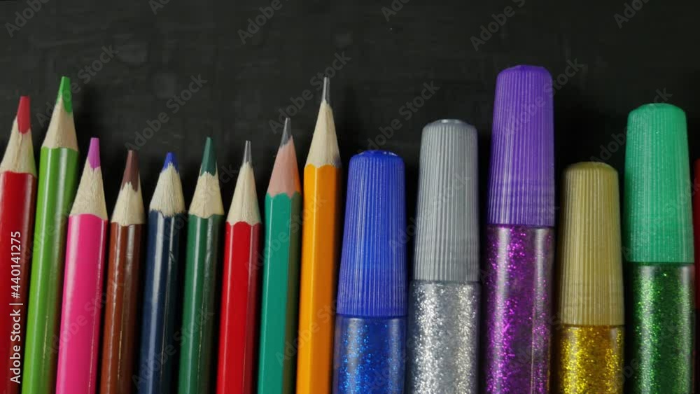 Back to school. Pencils, markers, markers in the center, place for text Back to school. Pencils, markers, markers in the center, place for text