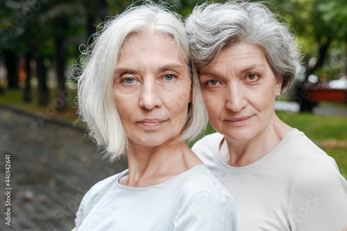 Confident mature women with grey hair photo
