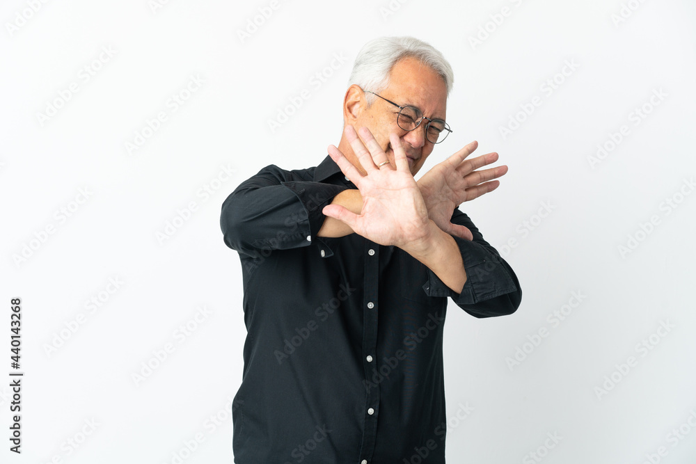Middle age Brazilian man isolated on white background nervous stretching hands to the front Middle age Brazilian man isolated on white background nervous stretching hands to the front