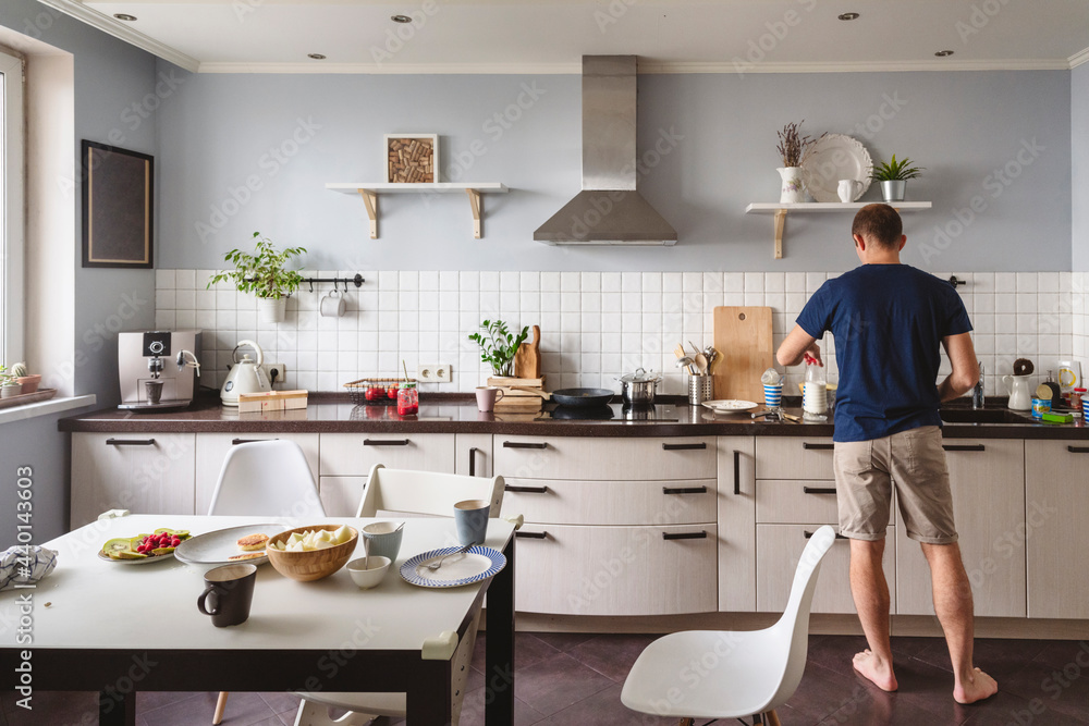 Mature man preparing food in kitchen at home Mature man preparing food in kitchen at home