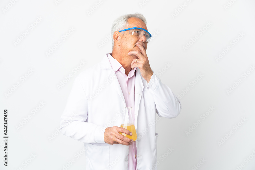Middle age Brazilian scientific man scientific isolated on white background having doubts Middle age Brazilian scientific man scientific isolated on white background having doubts