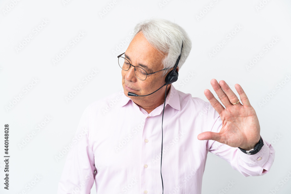 Telemarketer Middle age man working with a headset isolated on white background making stop gesture and disappointed Telemarketer Middle age man working with a headset isolated on white background making stop gesture and disappointed