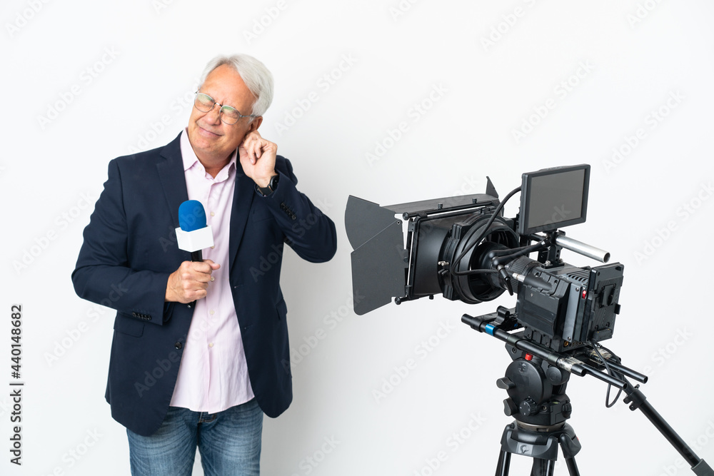 Reporter Middle age Brazilian man holding a microphone and reporting news isolated on white background frustrated and covering ears