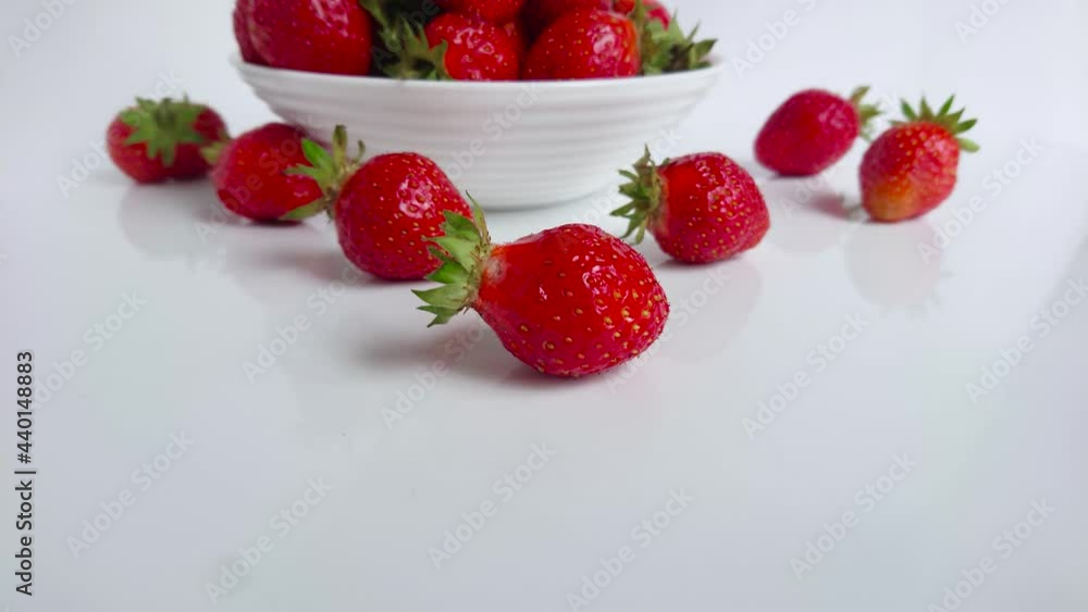Red ripe strawberry in the white bowl, light background Red ripe strawberry in the white bowl, light background