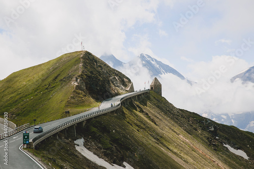 Austria, Carinthia, Grossglockner High Alpine Road leading by mountain peak photo