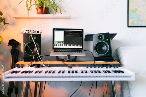 Electric piano and laptop at recording studio