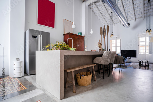 Interior of loft apartment with refrigerator photo