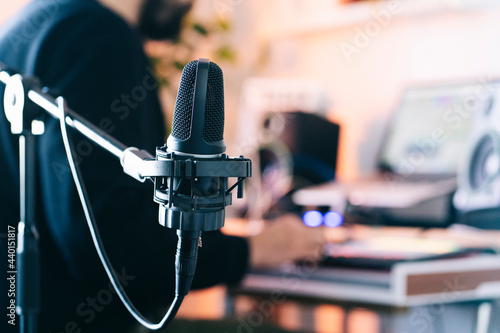 Condenser microphone on stand in studio photo