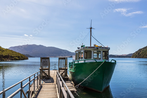 Fishboat moored by wooden pier photo