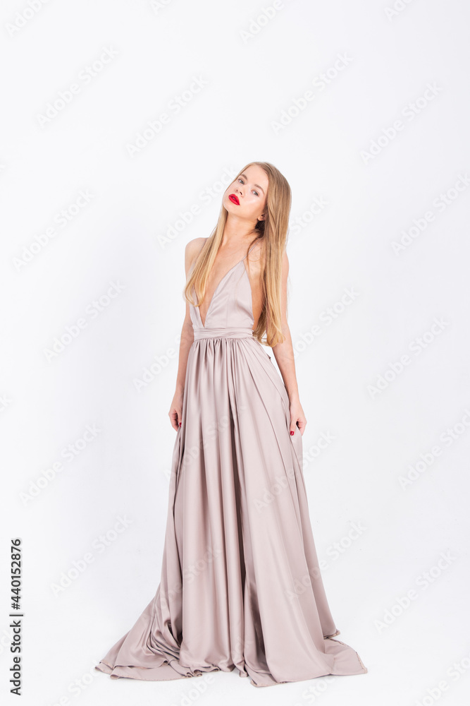 young girl in a wedding dress on a white background