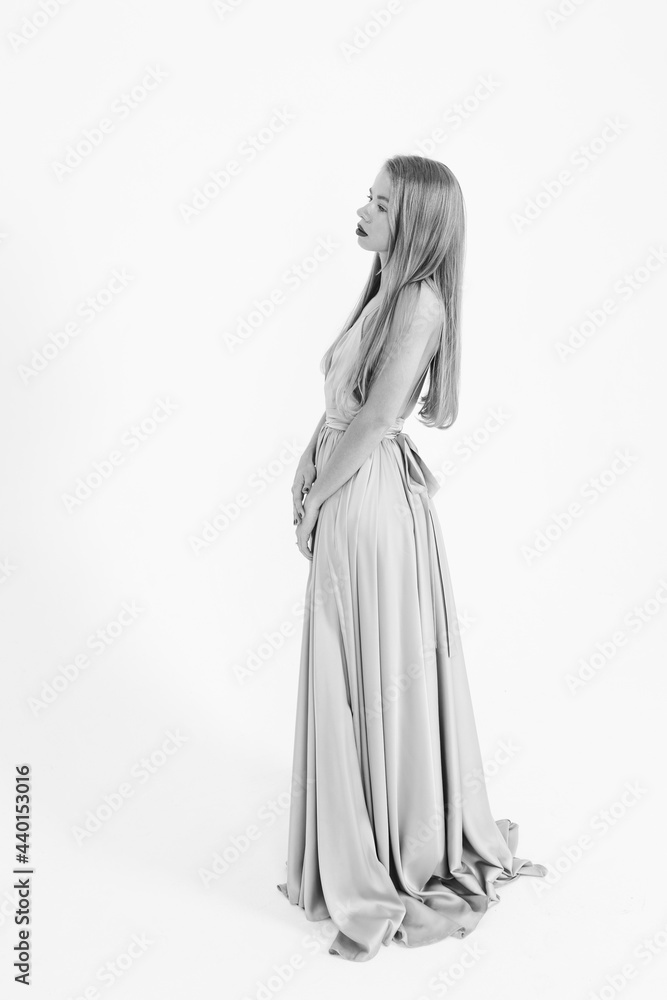 young girl in a wedding dress on a white background