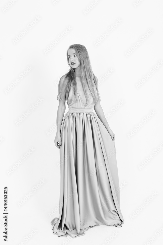 Naklejka premium young girl in a wedding dress on a white background