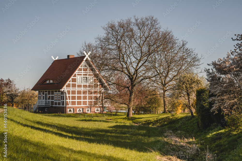 Germany, Altes Land, Idyllic rural scene with farmhouse in spring Germany, Altes Land, Idyllic rural scene with farmhouse in spring