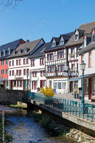 Germany, North Rhine Westphalia, Bad Munstereifel, Houses along Erft river photo