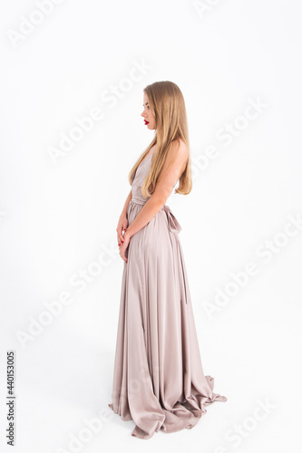 young girl in a wedding dress on a white background