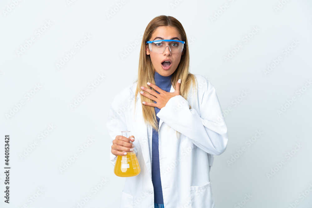 Young scientific woman isolated on white background surprised and shocked while looking right Young scientific woman isolated on white background surprised and shocked while looking right
