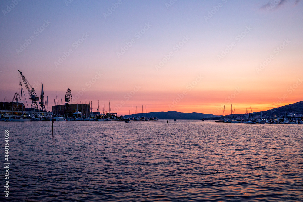 Croatia, Split-Dalmatia County, Trogir, Commercial dock on Ciovo island at moody dusk Croatia, Split-Dalmatia County, Trogir, Commercial dock on Ciovo island at moody dusk