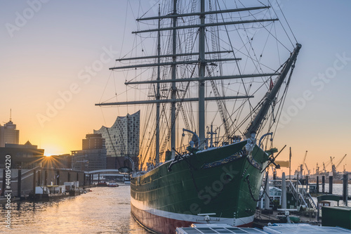 Germany, Hamburg, Museum ship Rickmer Rickmers at sunrise with Elbe Philharmonic Hall in background  photo