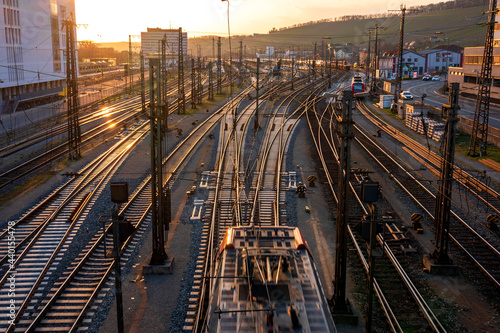 Germany, Bavaria, Wurzburg, Empty railroad tracks at sunset photo