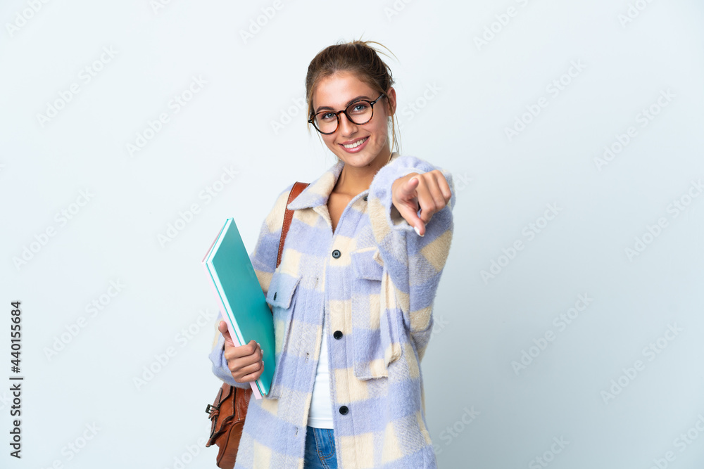 Young student woman isolated on white background pointing front with happy expression Young student woman isolated on white background pointing front with happy expression