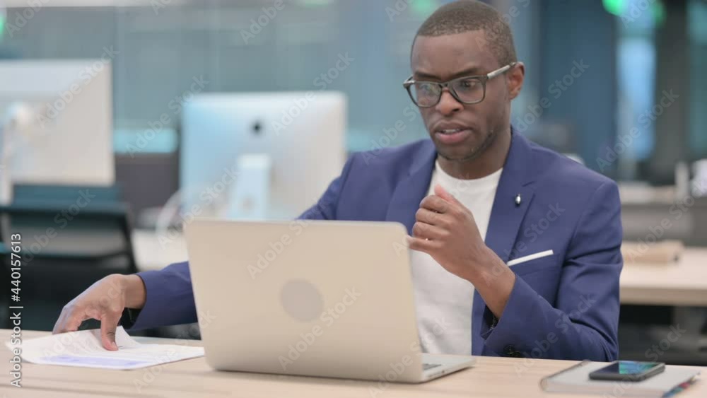 Young African Businessman Talking on Video Call on Laptop Young African Businessman Talking on Video Call on Laptop
