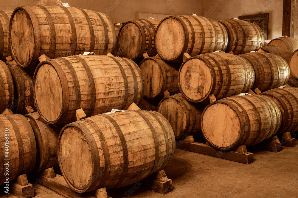 Wine barrels on old cellar. Warm and desaturated tones