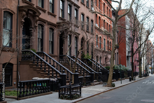 Row of Beautiful Old Homes with Stairs along a Street in Greenwich Village of New York City