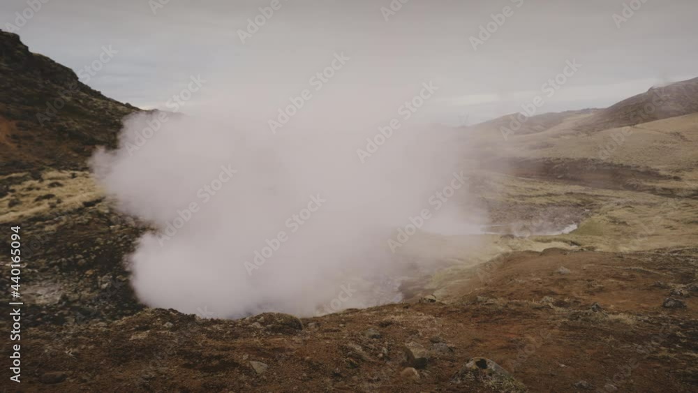 Zooming Shot of a Mountain Range Releasing Vapor Underneath Zooming Shot of a Mountain Range Releasing Vapor Underneath