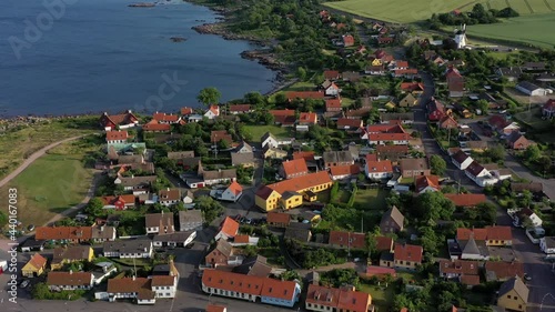 4K Drohneflug im Abendlicht über den kleinen Bornholmer Ort Årsdale  photo