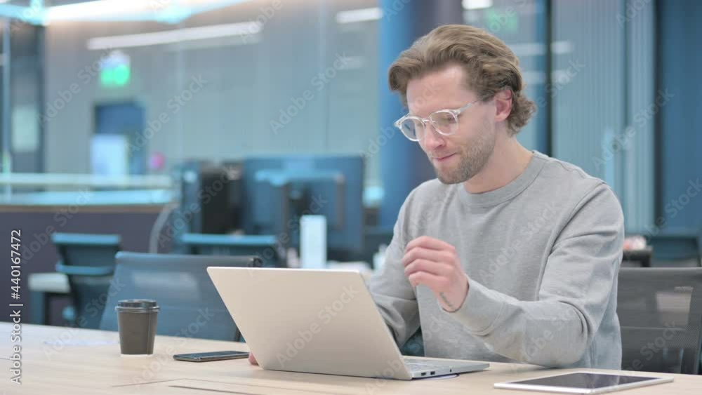 Young Businessman with Laptop having Loss, Failure Young Businessman with Laptop having Loss, Failure