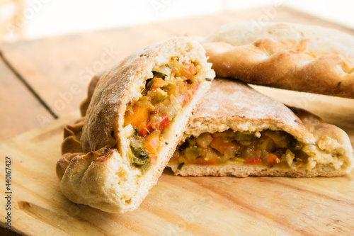 Traditional argentinian empanadas on wooden table