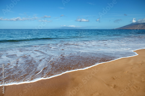 Fototapeta Naklejka Na Ścianę i Meble -  Beach background. Calm beautiful ocean wave on sandy beach. Sea view from tropical sea beach.