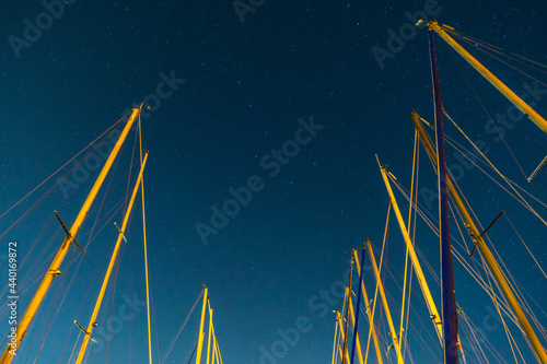 Obraz na plátně Big Dipper constellation on the night sky between masts of sailing boats, Nether