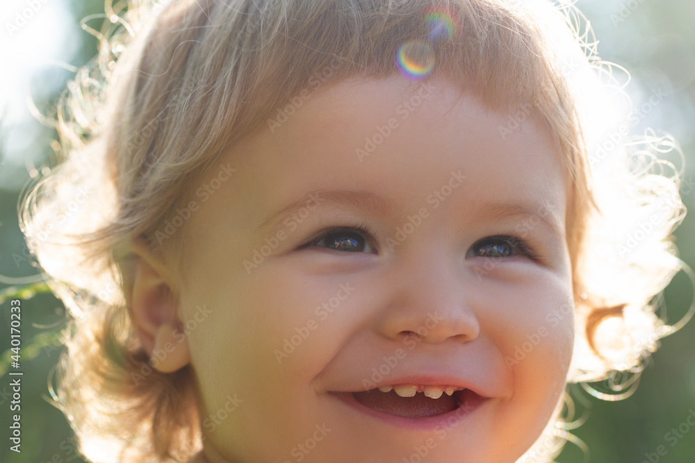 Portrait of a happy laughing child. Close up positive kids cropped face. Baby smiling, cute smile. Portrait of a happy laughing child. Close up positive kids cropped face. Baby smiling, cute smile.