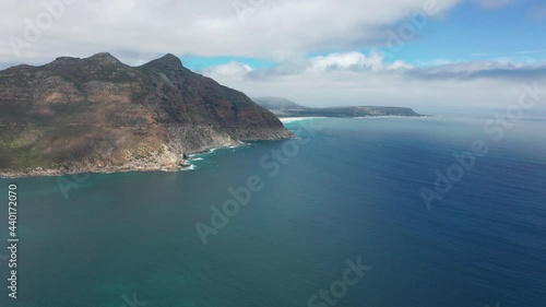 Aerial view. Chapmans Peak Drive near Cape Town, South Africa. Top view of road going through beautiful landscape. Road bending along the ocean.