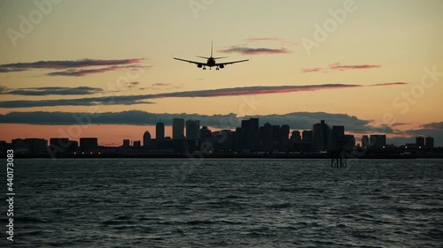 boston airplane landing sunset silhouette