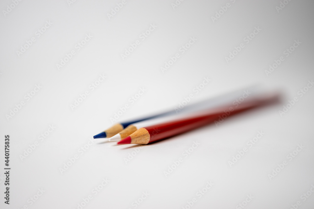 Red, White, and Blue Colored Pencils on White Background