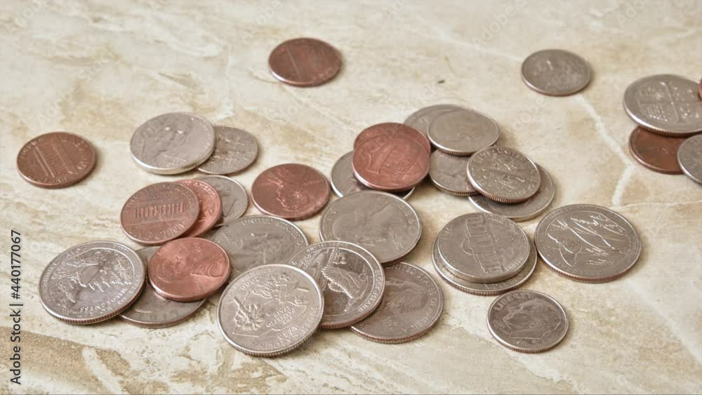 A large mound of coins disappearing, stop motion animation
A large mound of coins disappearing, stop motion animation