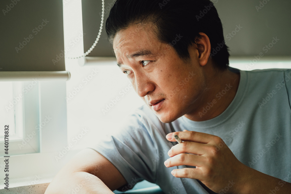 Asian man feels desperate for smoking addiction
Asian man feels desperate for smoking addiction