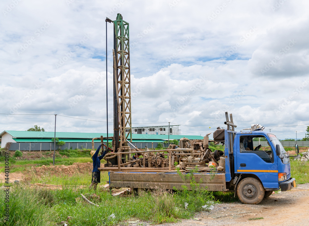 Man drilling insert Tube Artesian Water. Man drilling insert Tube Artesian Water.