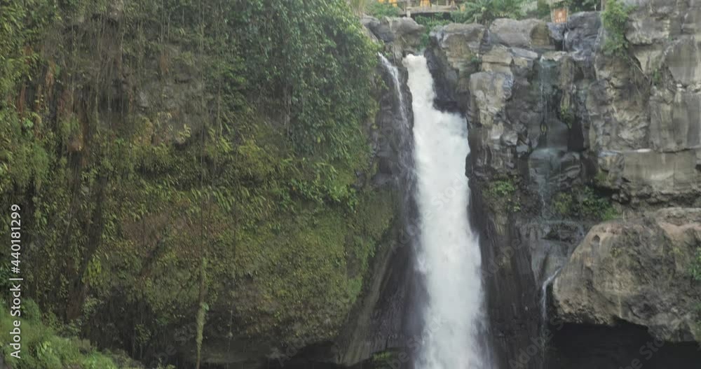 Scenic nature of amazing waterfall in Bali during morning. Shot in slow motion. Scenic nature of amazing waterfall in Bali during morning. Shot in slow motion.