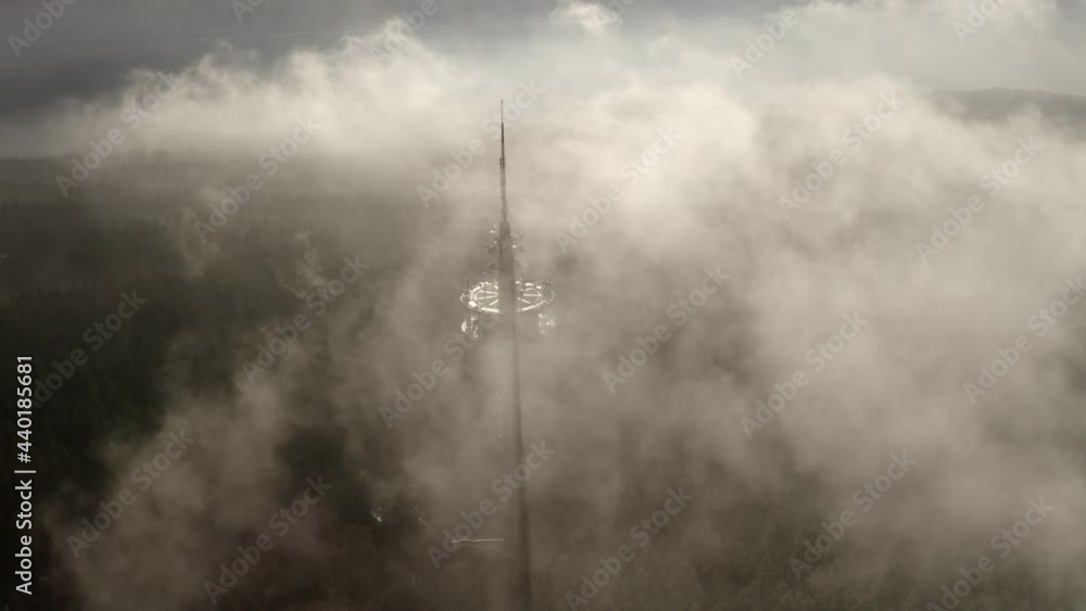 Aerial view over TV Tower inside Germany Forest

Drone view over Morning Fogy mist day, Germany, 2021

